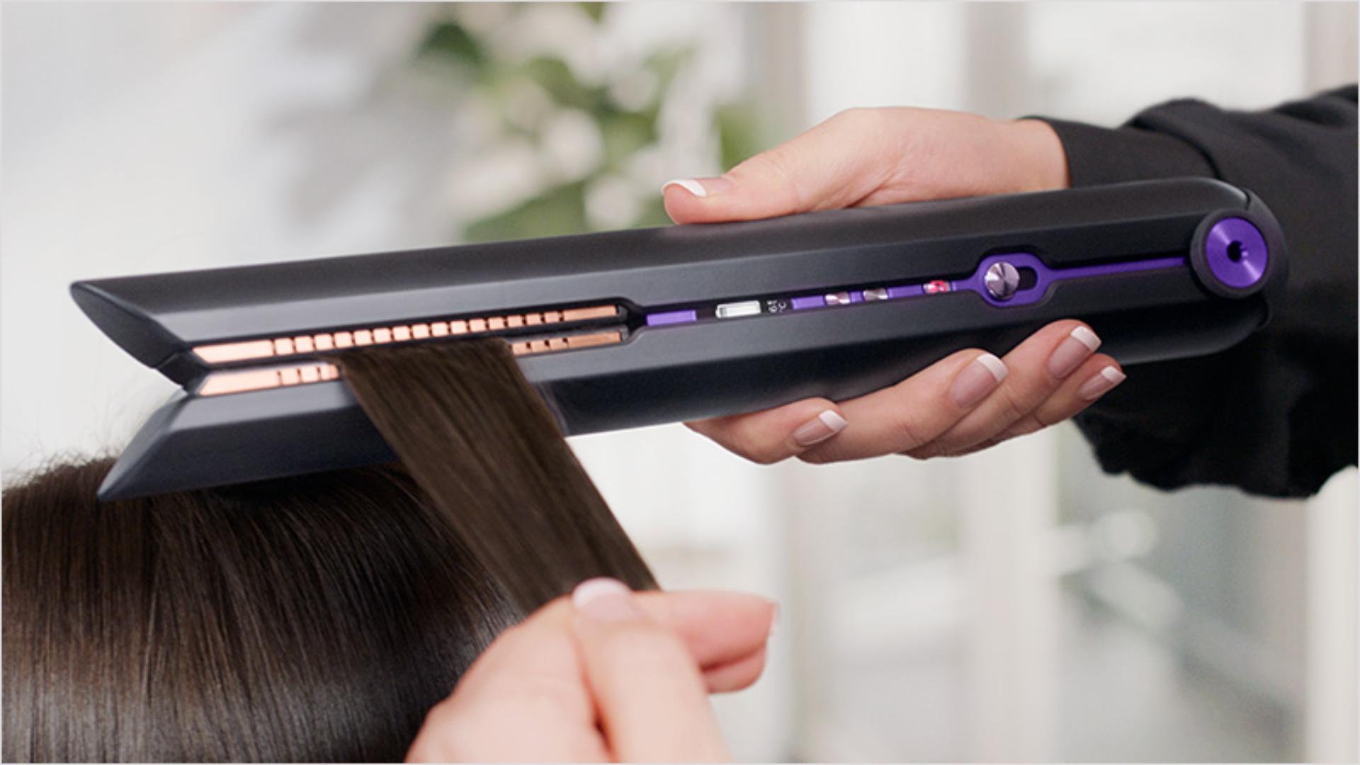 Close up of hair being gathered by the flexing plates on the Dyson Corrale hair straightener