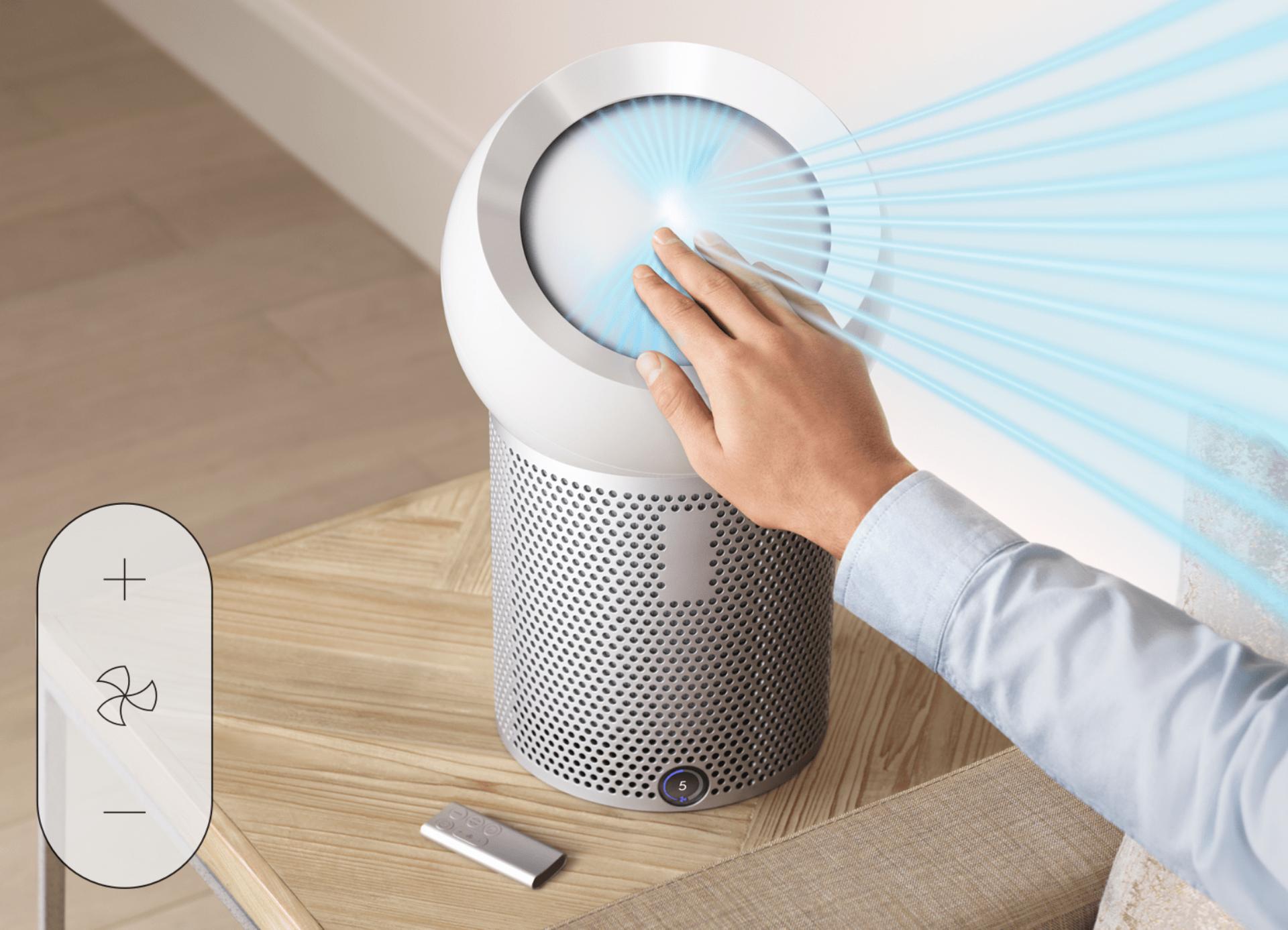 Hand reaching out to refocus airflow of Dyson Pure Cool Me™ 