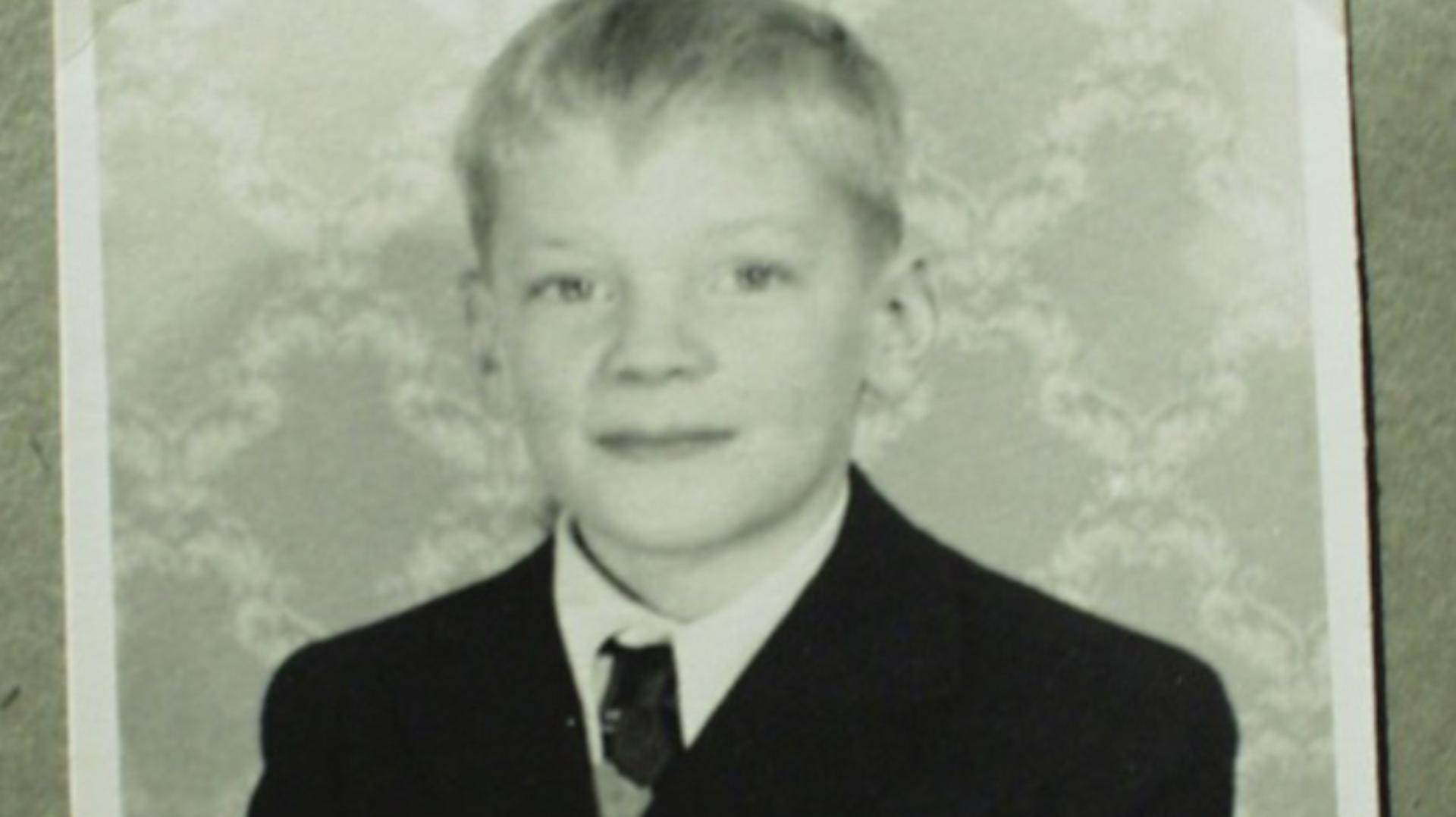 James Dyson wearing a shirt, tie, and school blazer