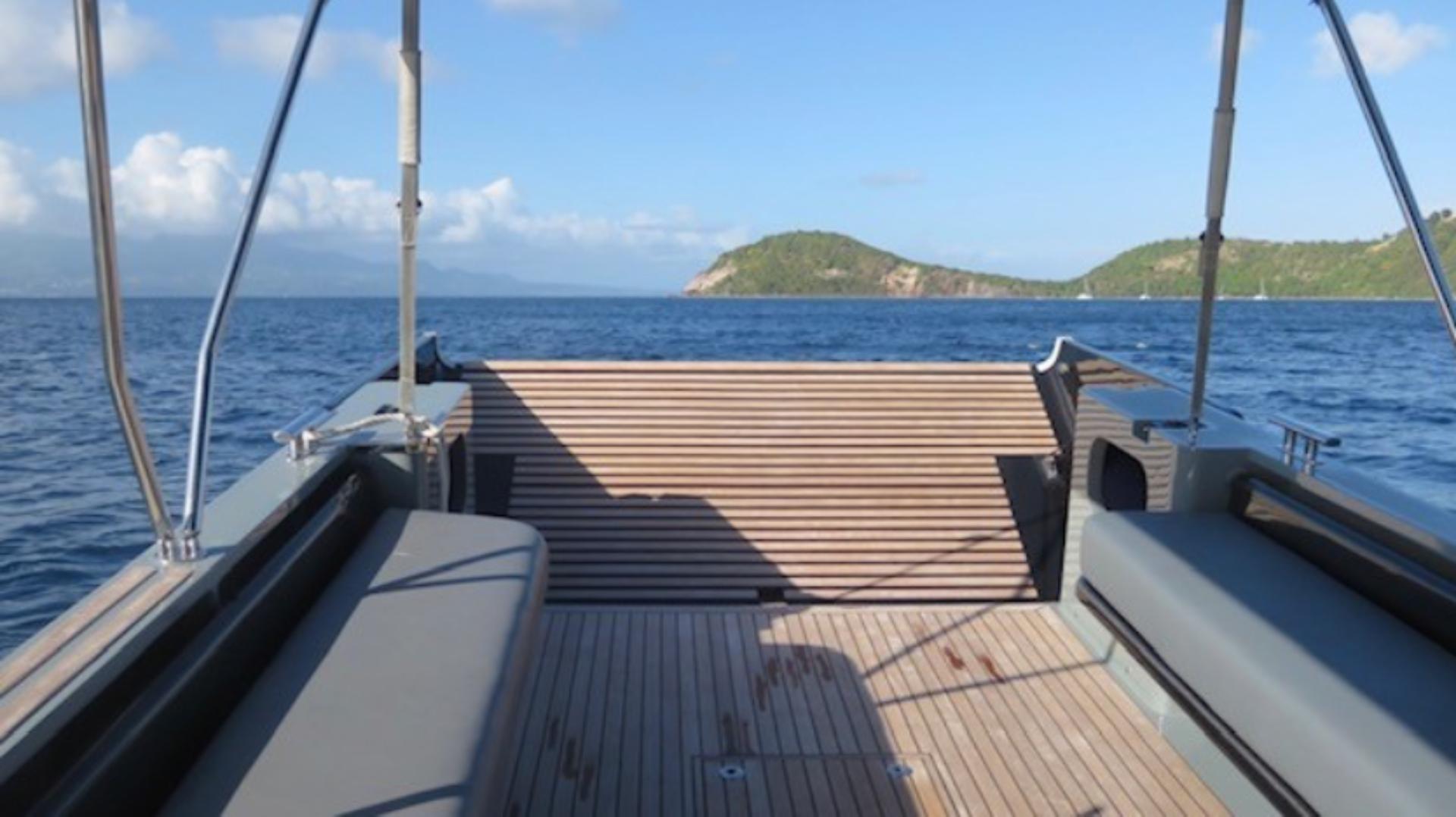 The rear-view out of a Sea Truck, overlooking blue seas