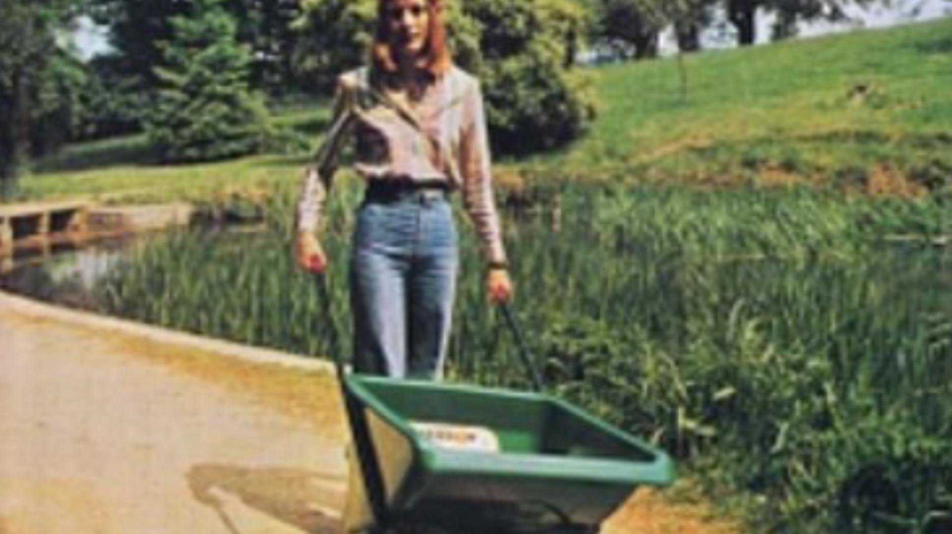 Deirdre Dyson pushing the Ballbarrow around Dodington Estate