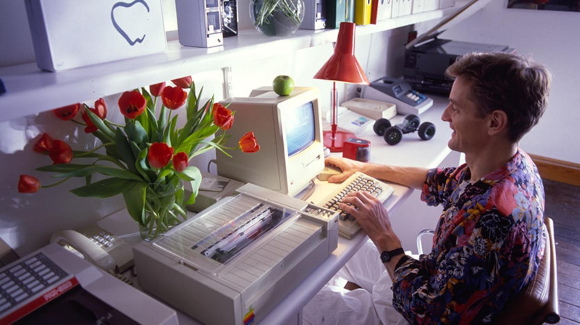 James Dyson working in front of desktop computer in Japan