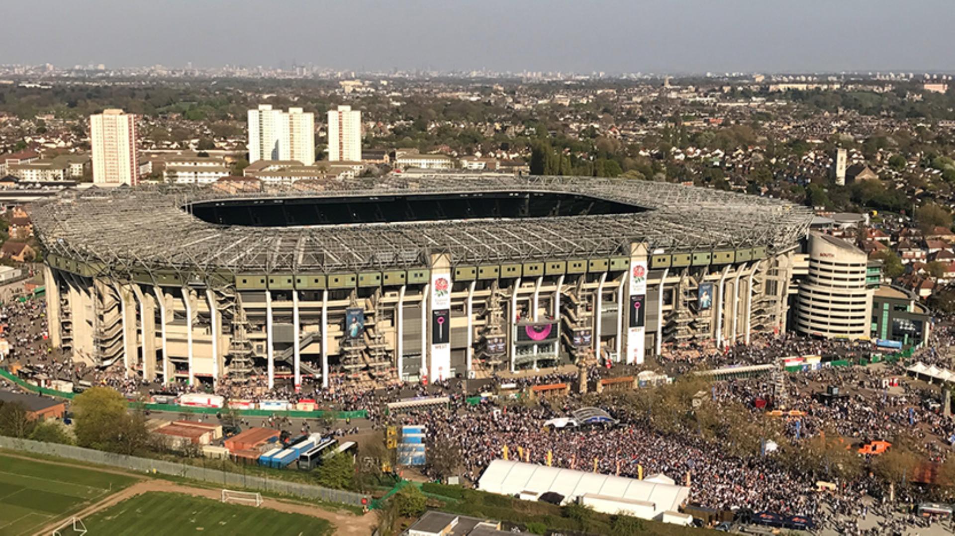 Twickenham stadium with banner advertising the Supersonic hair dryer