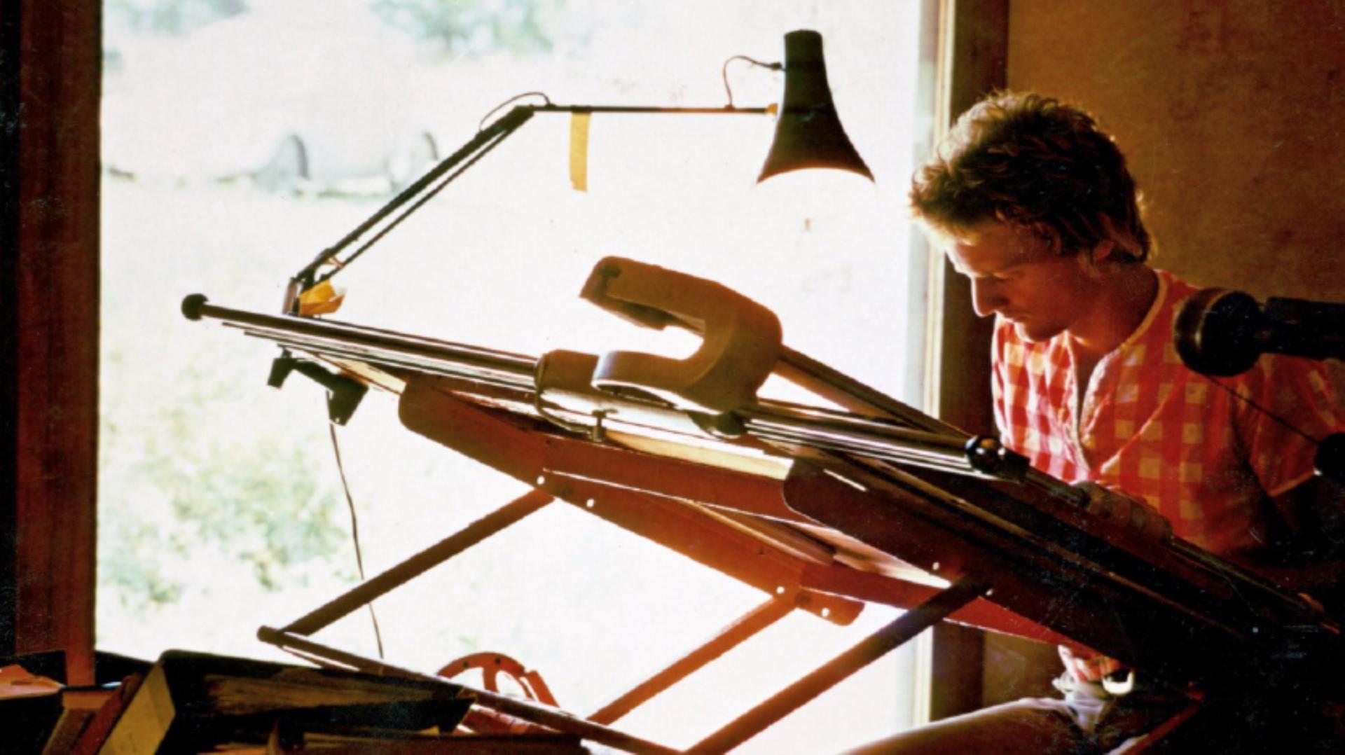 James Dyson sitting at a technical drawing board