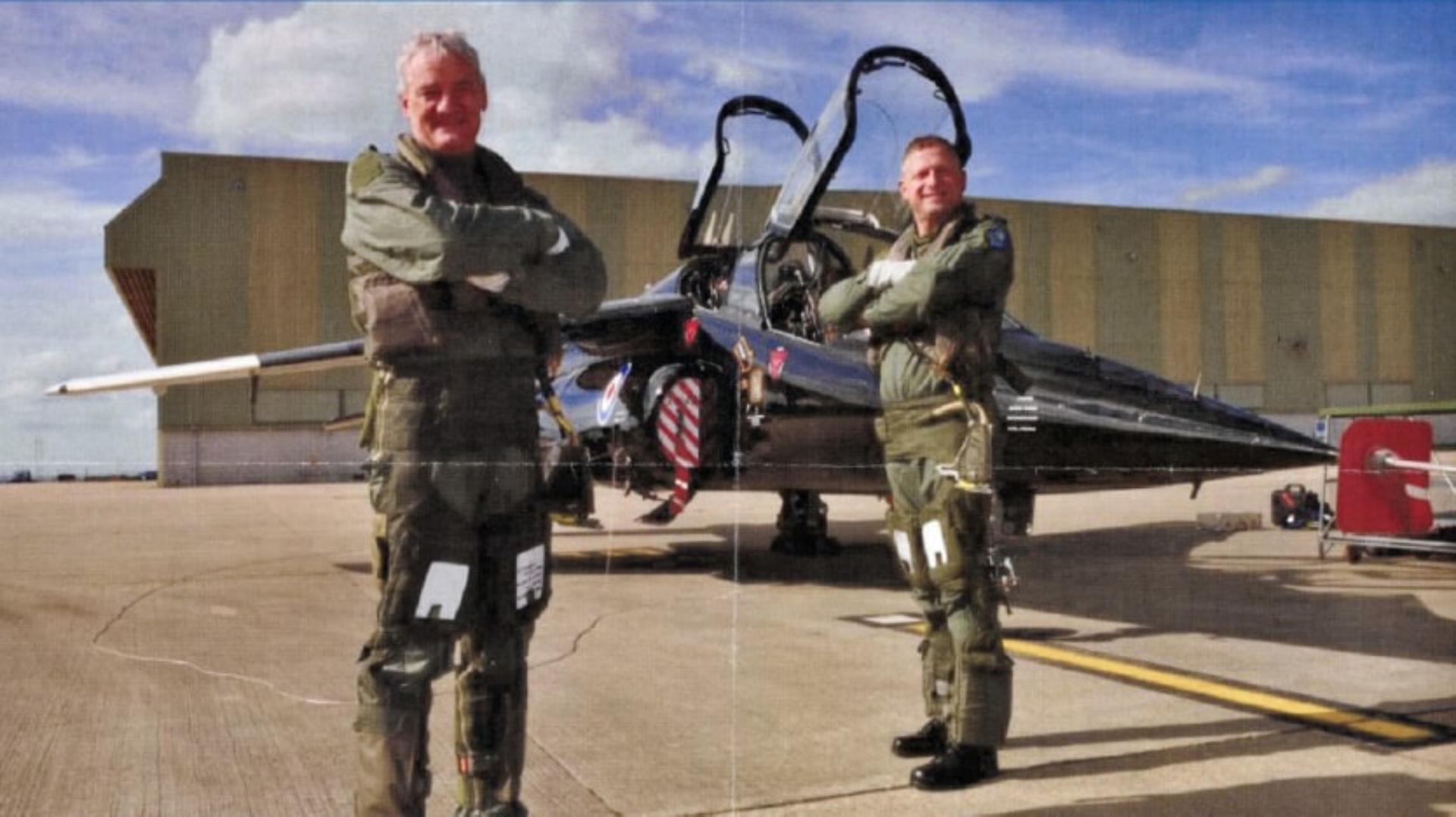 James Dyson and a pilot stand in front of a small jet plane