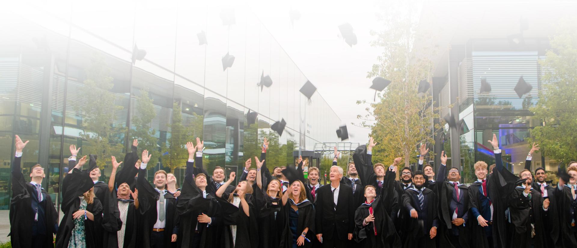 Dyson students throwing mortar boards on the Dyson Malmesbury campus