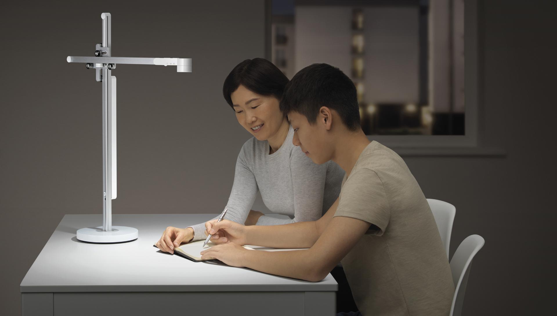 Mother and son studying under Dyson Lightcycle