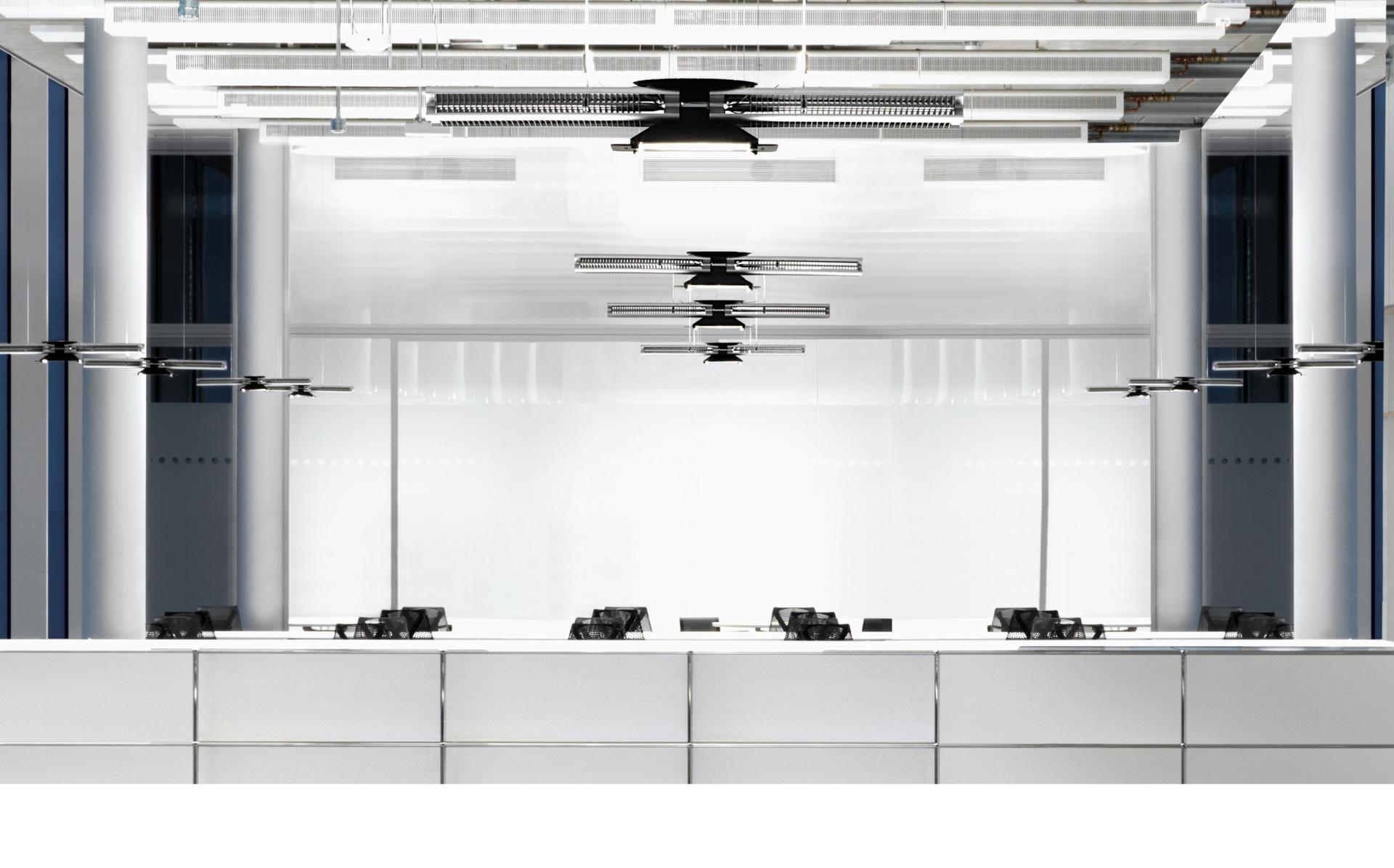 Dyson lights hanging over office desks