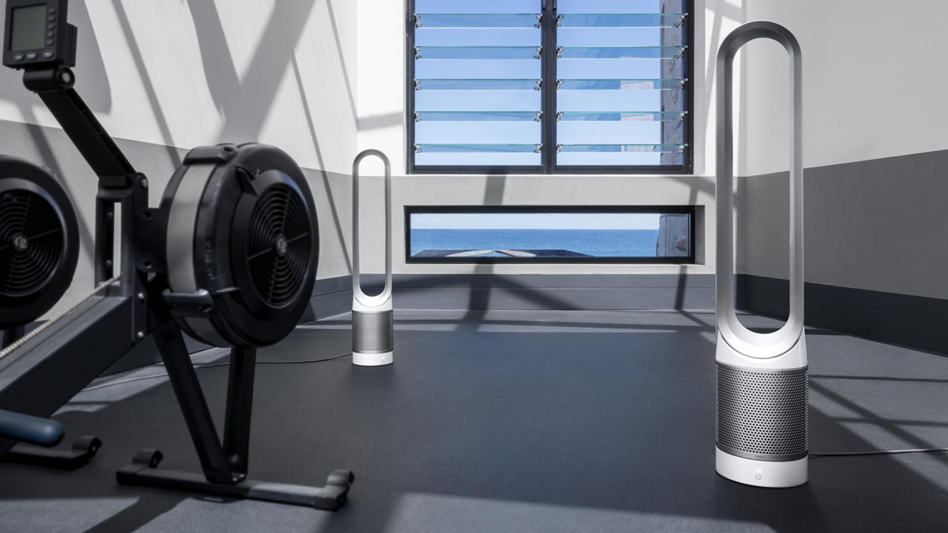 Dyson Pure Cool™ purifiers next to The Well's gym equipment